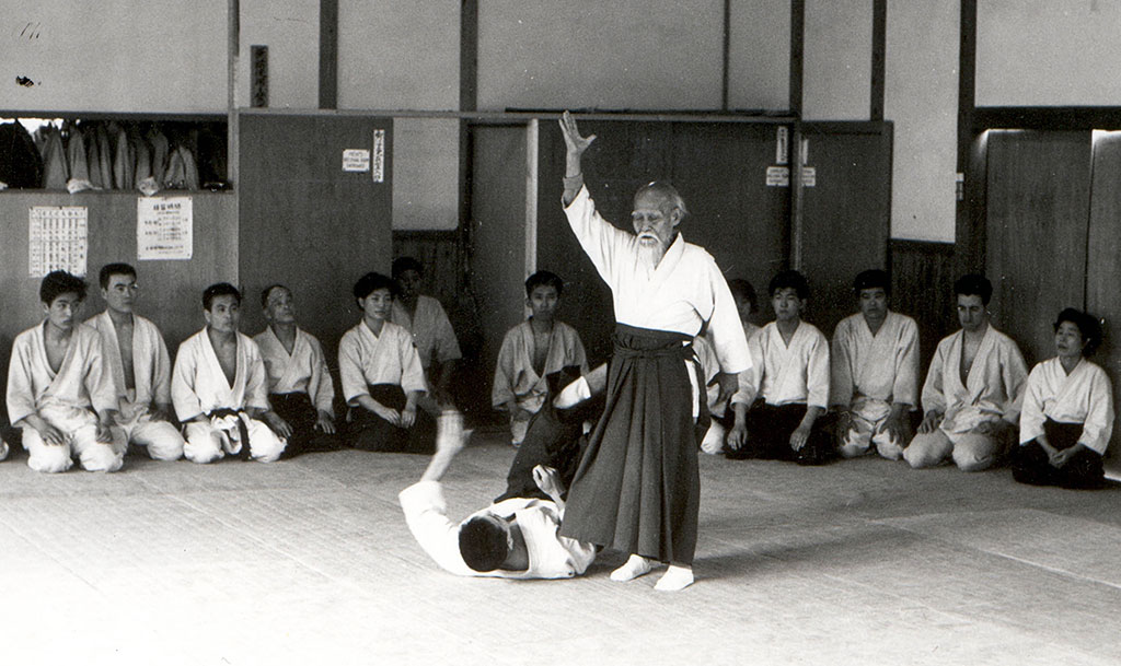 O Sensei teaching at the Hombu Dojo. Ruddock is visible, second from the right. 