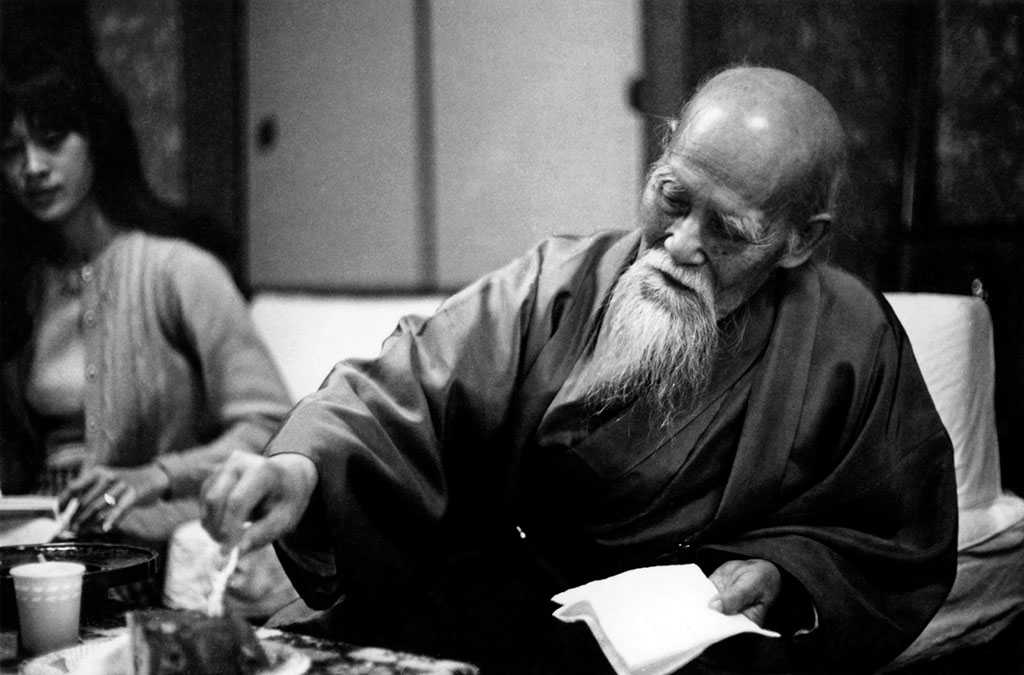 O Sensei eating his birthday cake. In the back is Joanne Willard.