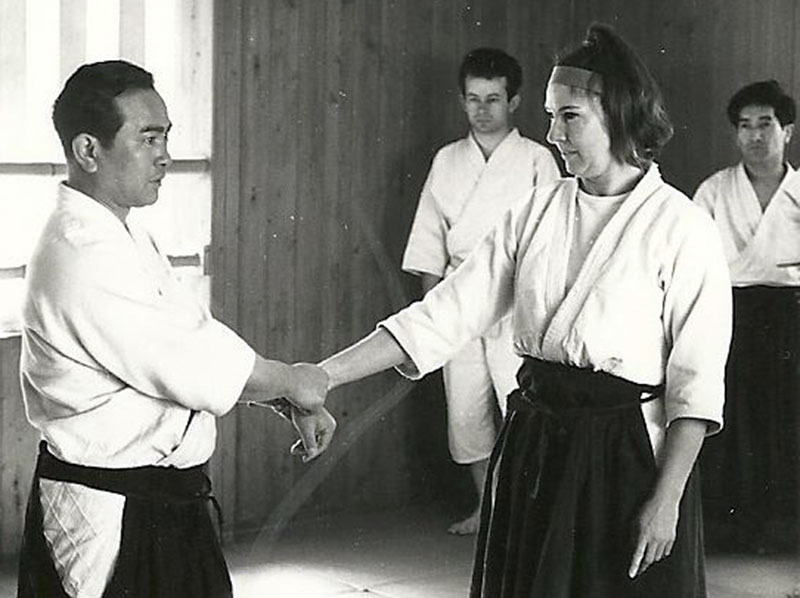 Tohei Koichi teaching Virginia Mayhew. At the beck on the right is Henry Kono.